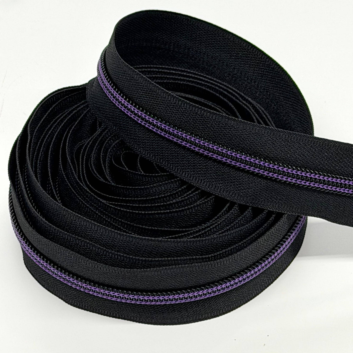 Black Zipper tape with Purple thread: 3yd
